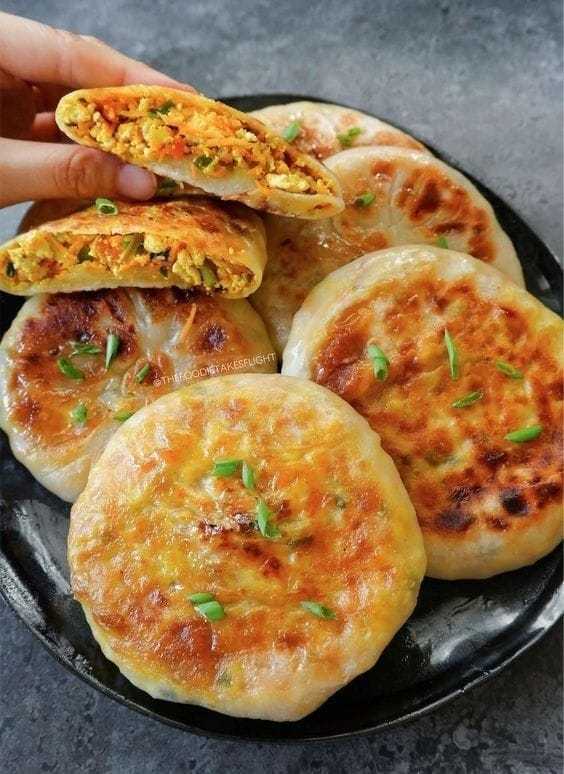 Pancakes filled with savory ingredients in Chinese style Pancakes filled with savory ingredients in Chinese style